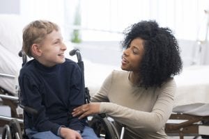 child with cerebral palsy working with therapist