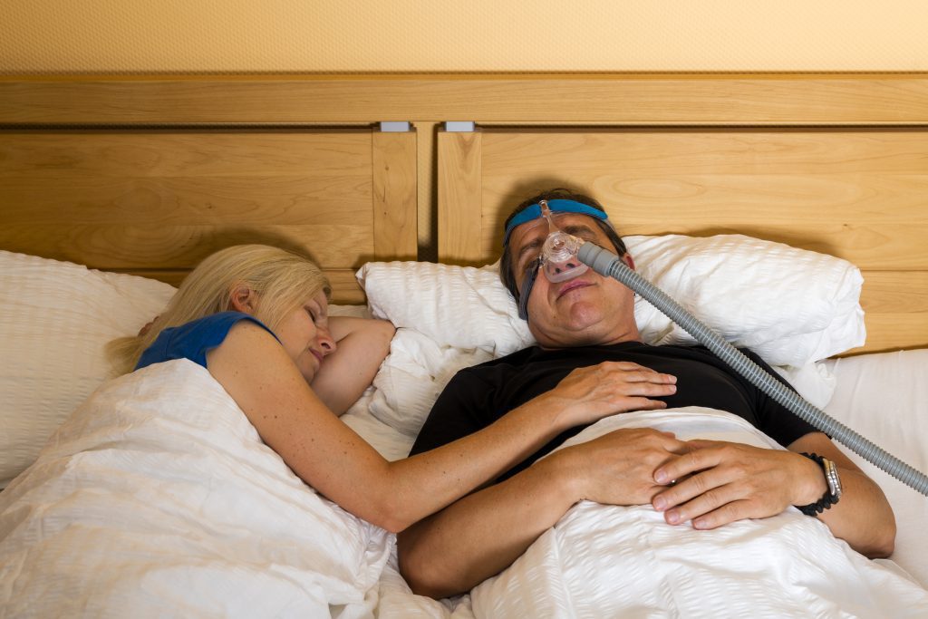 Man using recalled Philips CPAP device
