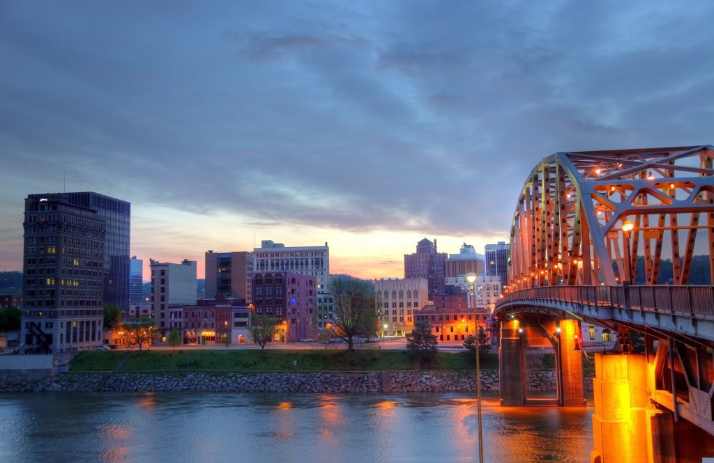 Charleston, WV roads and bridges lit up at night.