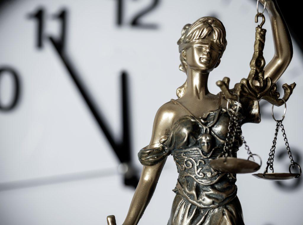 Clock and Lady Justice counting down the statute of limitation for West Virginia claims