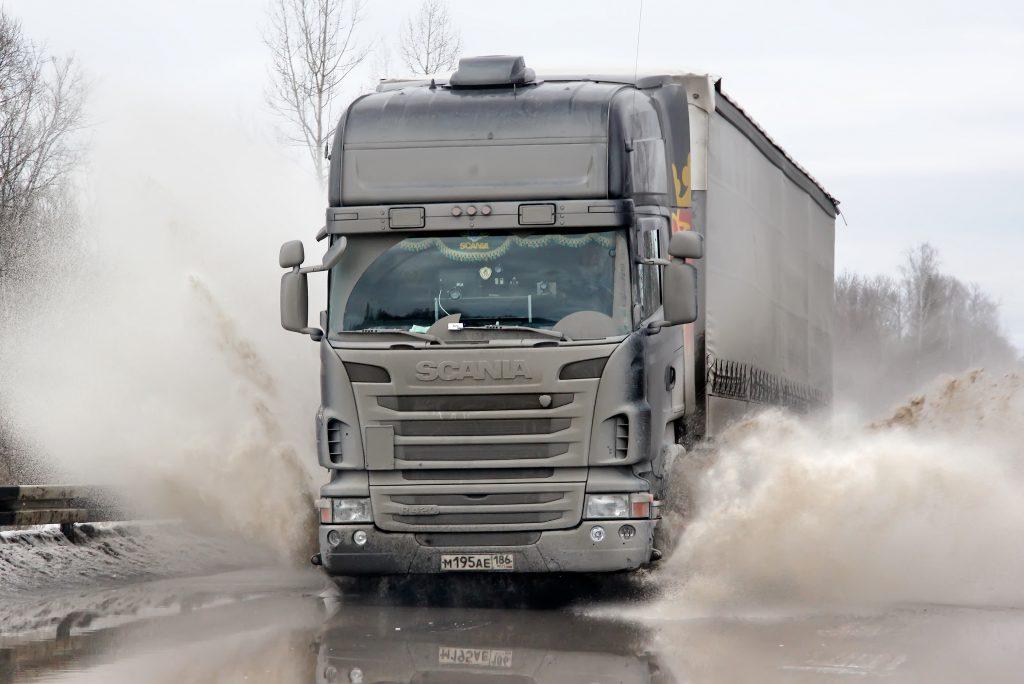Tractor Trailer driving in the rain on West Virginia highway
